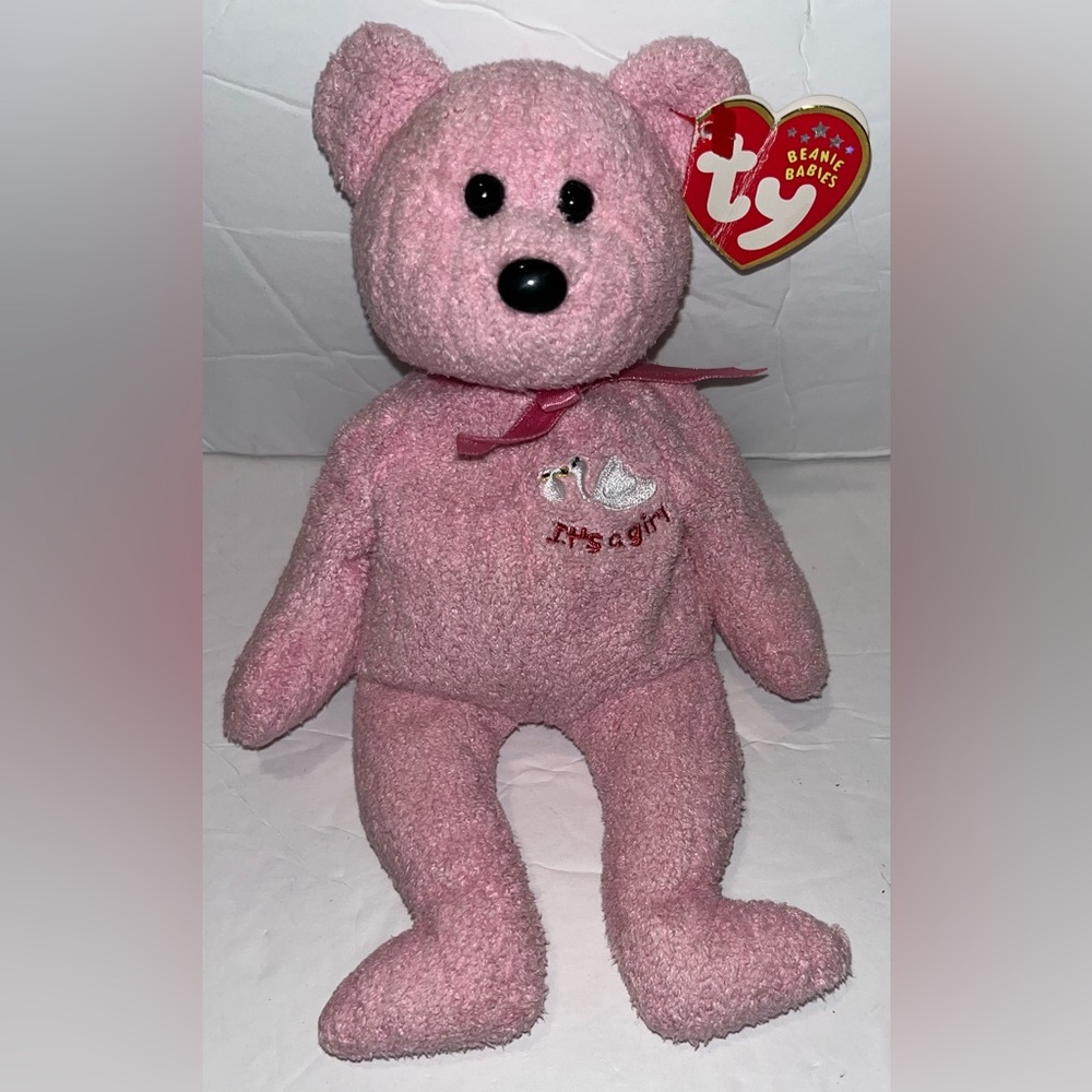 TY Beanie Baby named “Baby Girl” the Bear, pink stuffed teddy bear.